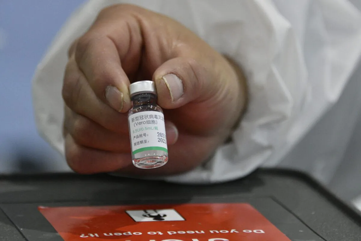 A health worker shows a vial of China's Sinopharm vaccine against COVID-19 at a health centre in La Paz, Bolivia, on March 1, 2021. (Aizar Raldes/AFP via Getty Images)