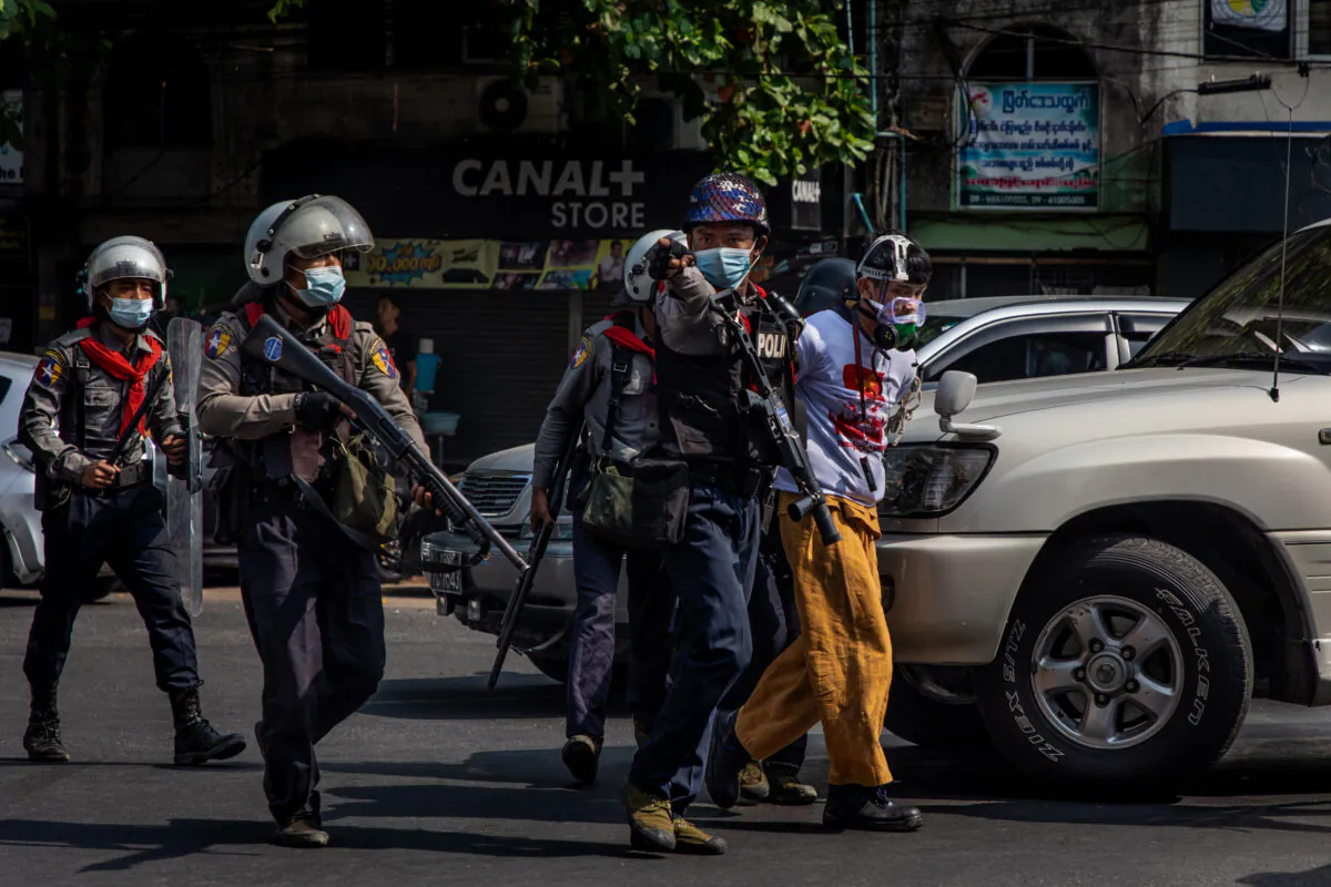 Riot police arrest anti-coup protesters in Yangon, Burma, on Feb. 27, 2021. (Hkun Lat/Getty Images)