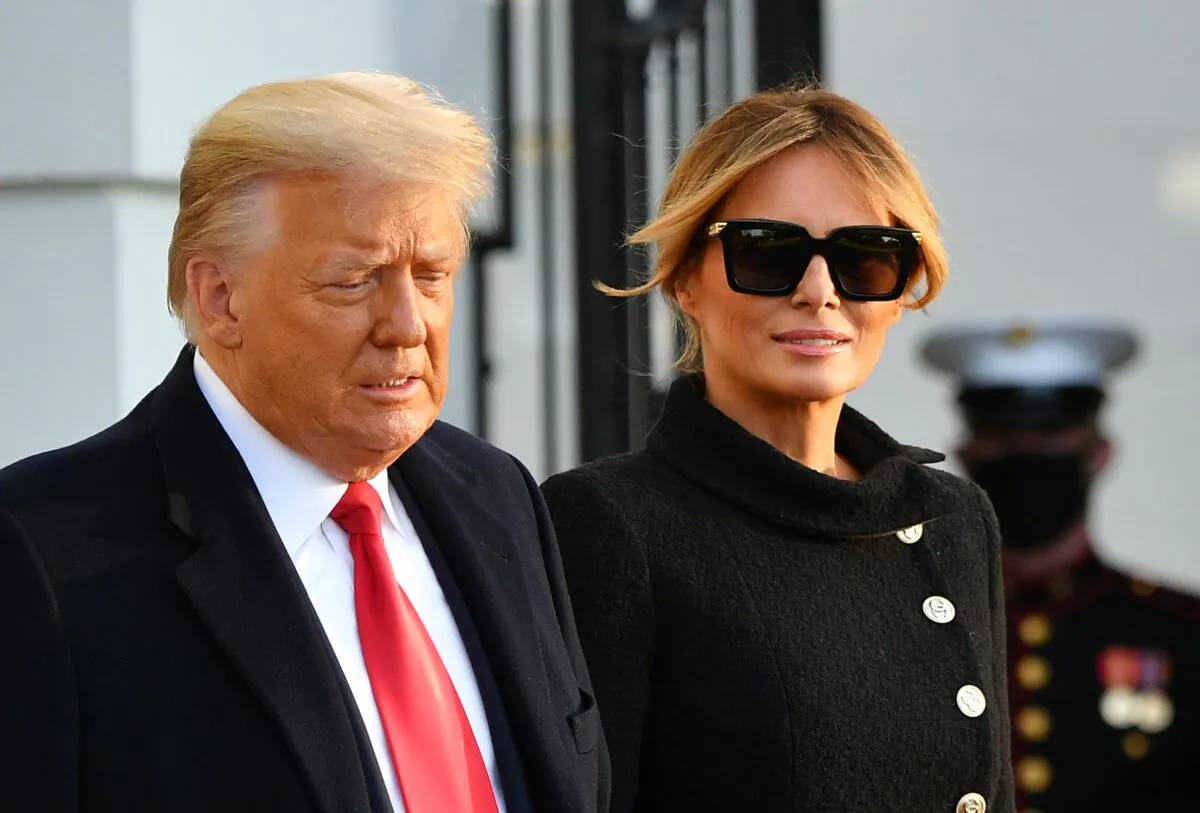 Then-President Donald Trump and First Lady Melania Trump make their way to board Marine One as they depart the White House in Washington on Jan. 20, 2021. (Mandel Ngan/AFP via Getty Images)