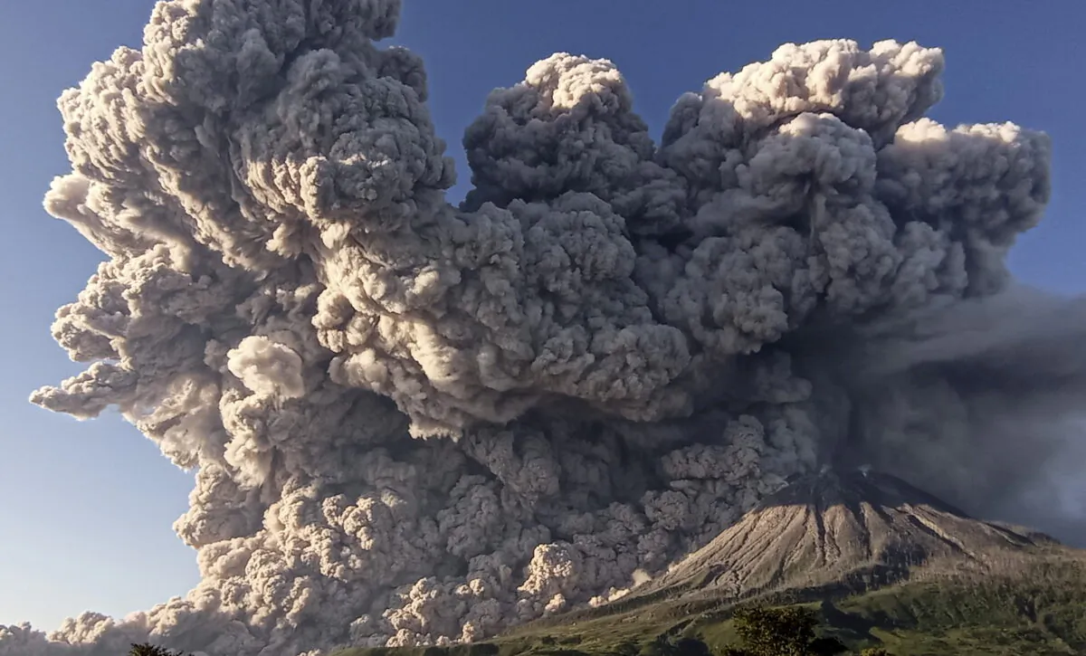 Mount Sinabung volcano erupts as seen from Kuta Rakyat village in Karo, North Sumatra Province, Indonesia, on March 2, 2021. (Antara Foto/Sastrawan Ginting/via Reuters)
