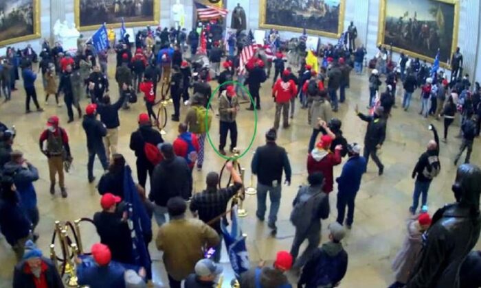 People are seen in an image from surveillance footage in the U.S. Capitol Rotunda in Washington on Jan. 6, 2021. (FBI)