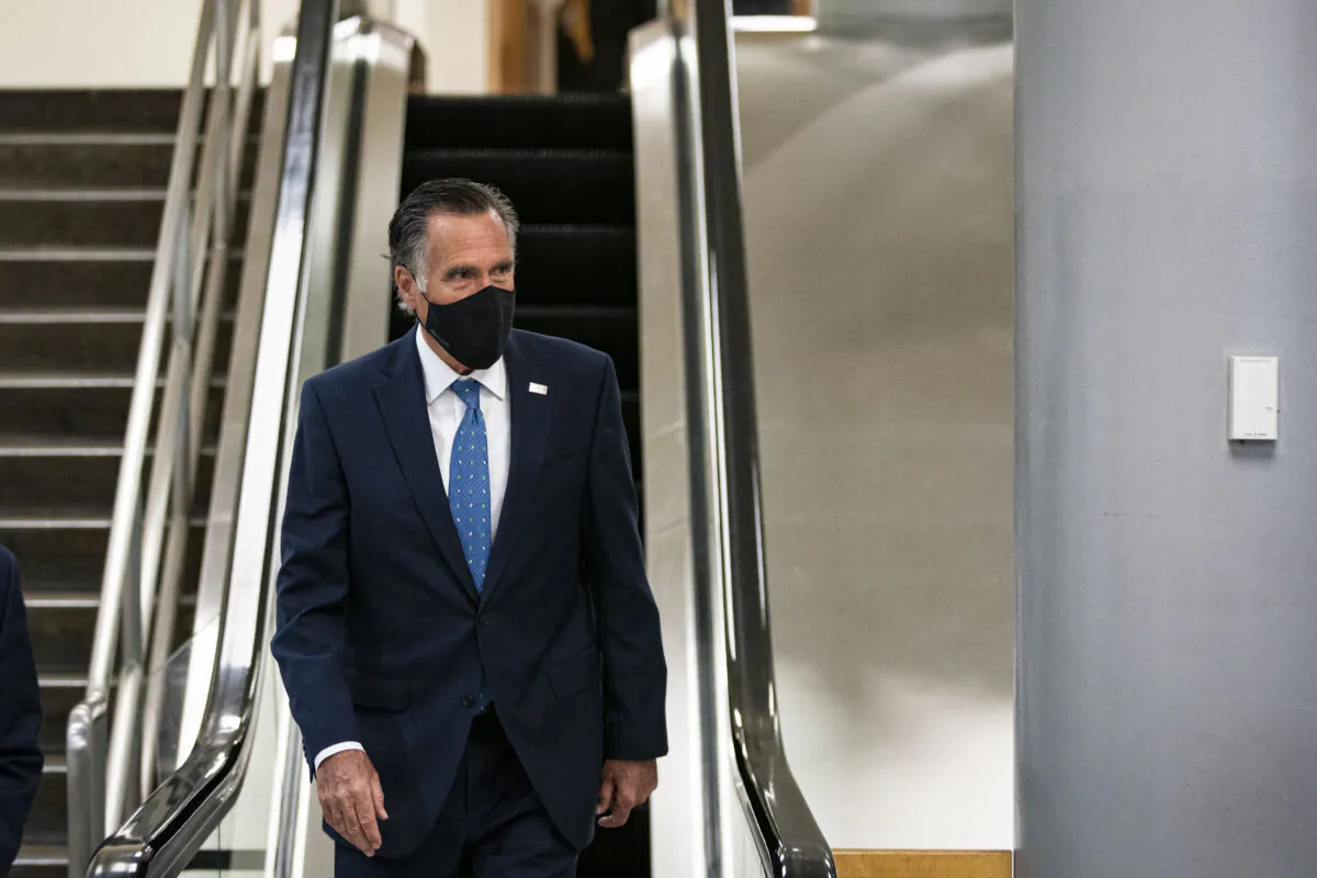 Sen. Mitt Romney (R-Utah) departs following a vote in the subway of the U.S. Capitol in Washington on Feb. 23, 2021. (Al Drago/Getty Images)