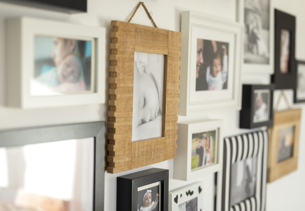 White,Wall,With,Photos,Of,The,Family,In,Various,Photo
