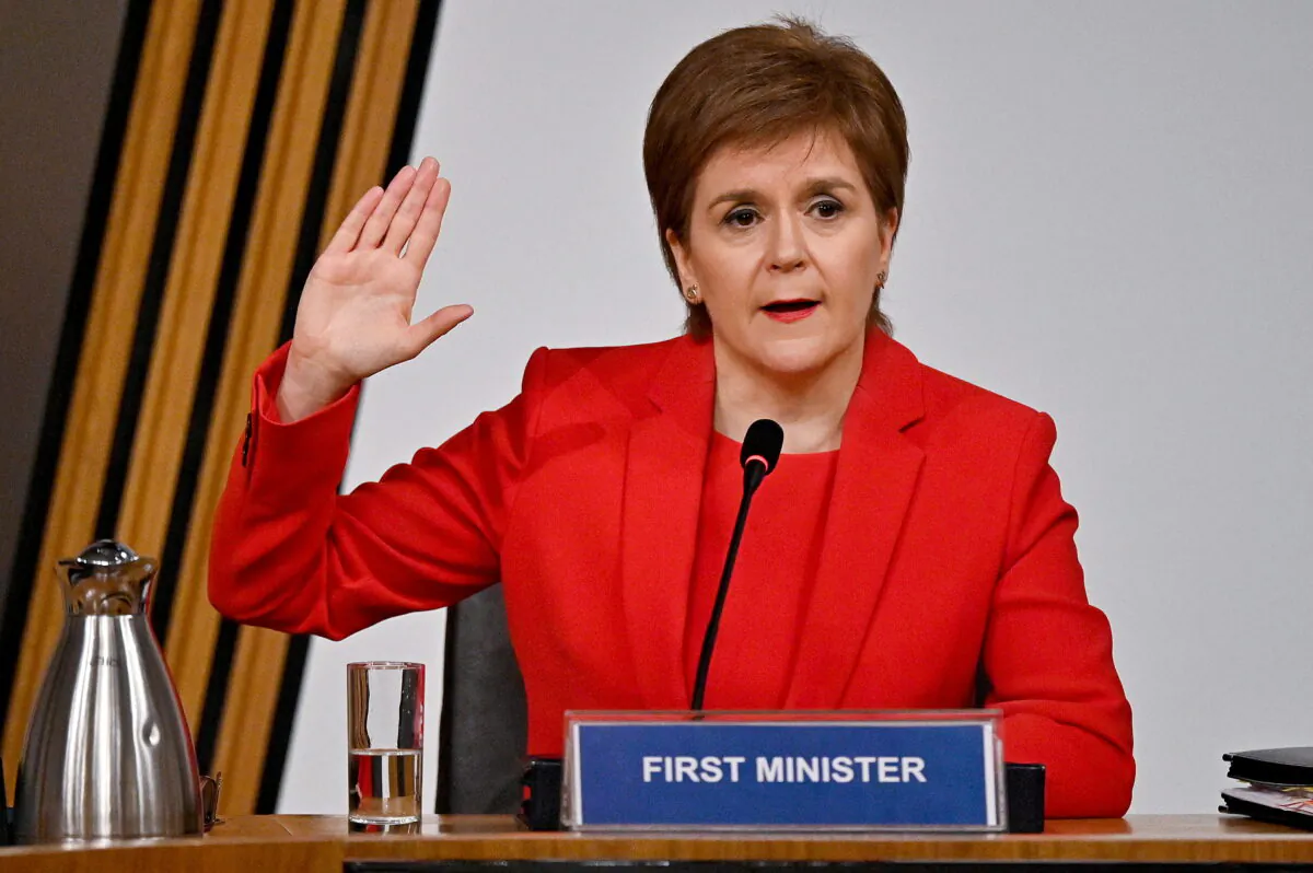 Scotland's First Minister Nicola Sturgeon gestures as she gives evidence to a Scottish Parliament committee examining the handling of harassment allegations against former First Minister of Scotland Alex Salmond, in Edinburgh, Scotland, Britain, on March 3, 2021. (Jeff J Mitchell/Pool via Reuters)
