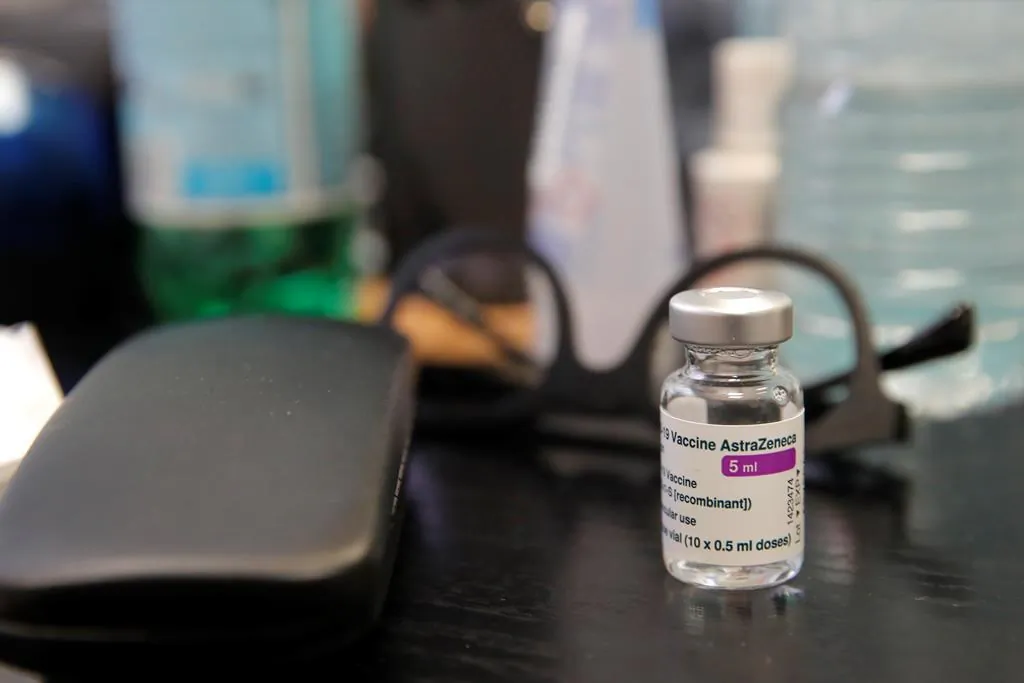 A vial of AstraZeneca COVID-19 vaccine is pictured at a doctor's office in Paris, France on Feb. 25, 2021. (AP Photo/Christophe Ena)
