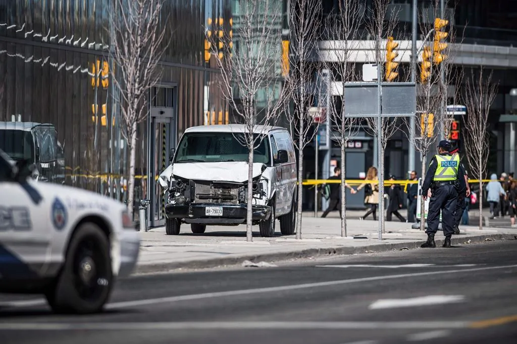 Police on scene after a van driven by Alek Minassian  mounted a sidewalk and crashed into a number of pedestrians, in Toronto, on April 23, 2018.
(Aaron Vincent Elkaim/The Canadian Press)
