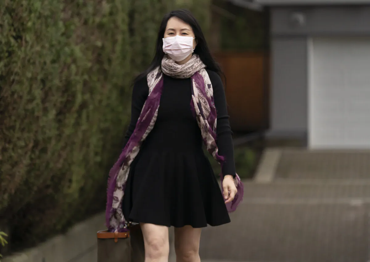 Meng Wanzhou, chief financial officer of Huawei, leaves her home as she heads to B.C. Supreme Court in Vancouver on March 3, 2021. (Jonathan Hayward/The Canadian Press)