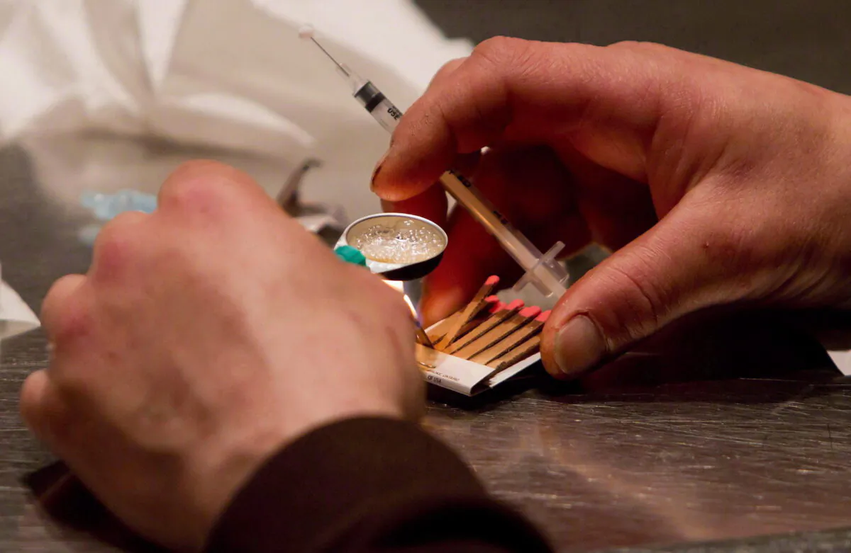 Heroin bought on the street is prepared for injection at the Insite safe injection clinic in Vancouver, B.C., on May 11, 2011.   (THE CANADIAN PRESS/Darryl Dyck)