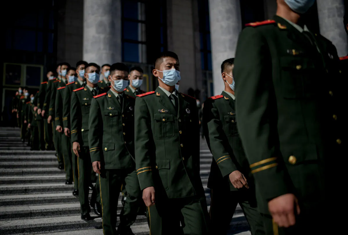 Chinese paramilitary police officers march outside the Great Hall of the People after the ceremony commemorating the 70th anniversary of China's entry into the Korean War, in Beijing on Oct. 23, 2020. (Noel Celis/AFP via Getty Images)