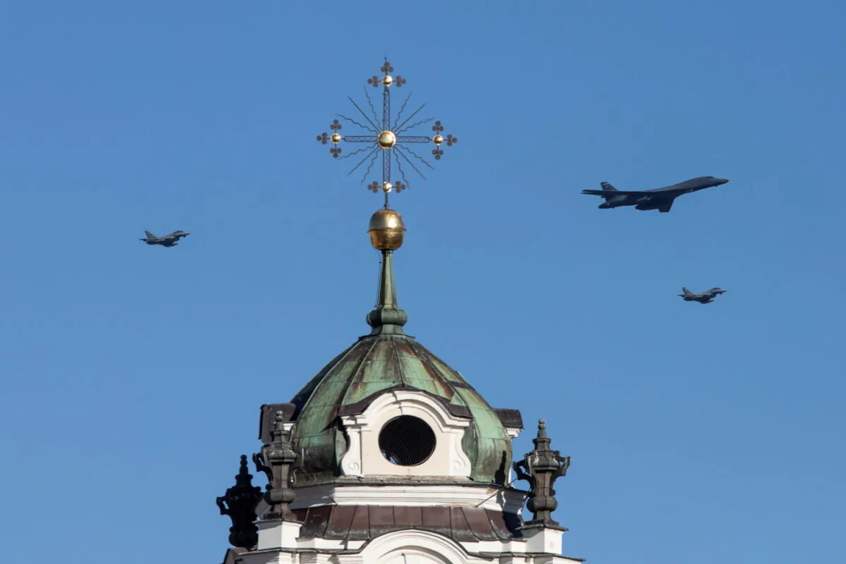 U.S. Air Force Rockwell B-1B Lancer bomber accompanied by two NATO air-policing Italian Eurofighter Typhoons fly over Vilnius, Lithuania, on March 3, 2021. (Ieva Budzekaite/Lithuanian Ministry of Defence/Handout via Reuters)