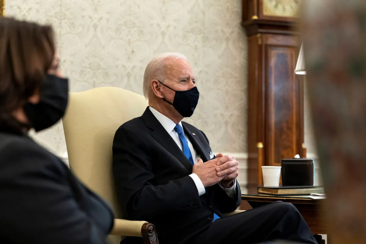U.S. President Joe Biden, accompanied by Vice President Kamala Harris, attends a meeting in the Oval Office at the White House in Washington on March 3, 2021. (Alex Brandon/Pool via Reuters)