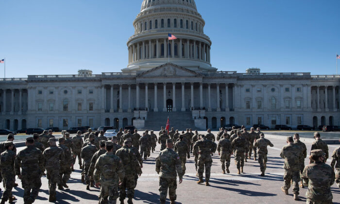 Members of the National Guard are seen on the East Front of the U.S. Capitol Building on Capitol Hill in Washington, on March 2, 2021. (Brendan Smialowski/AFP via Getty Images)