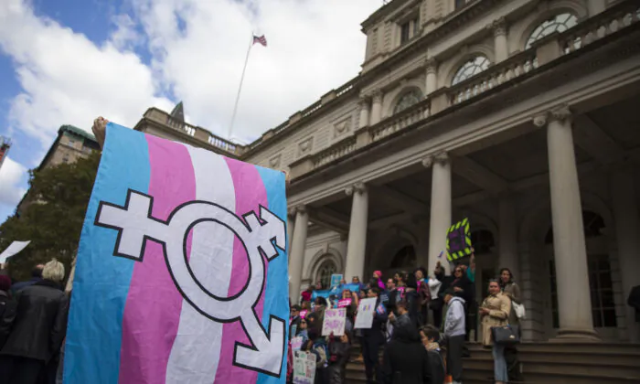 LGBT activists and their supporters rally in support of transgender people on the steps of New York City Hall on Oct. 24, 2018. (Drew Angerer/Getty Images)