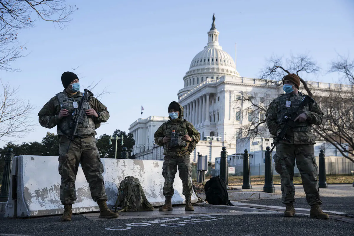 Members of the National Guard wear protective masks on duty outside of the U.S. Capitol in Washington on March 4, 2021. (Sarah Silbiger/Getty Images)