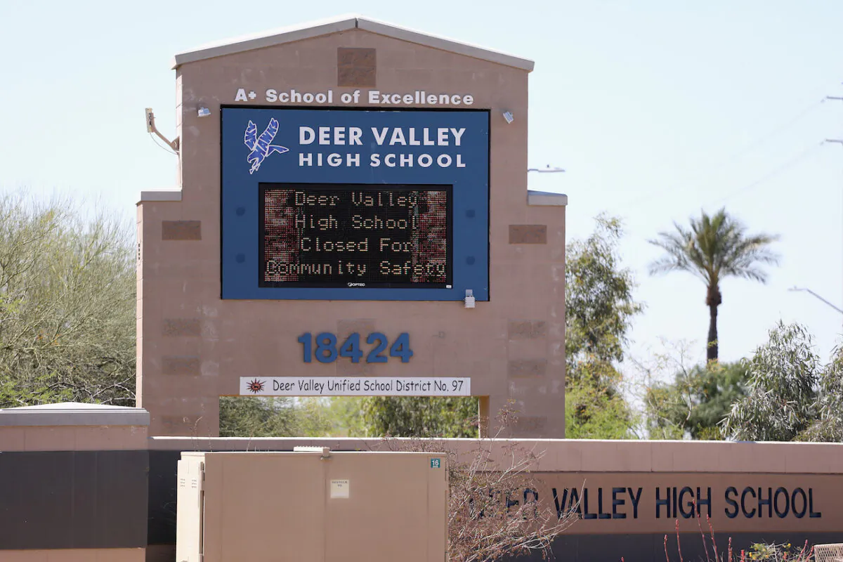 A sign indicating school closure due to the spread of the CCP virus is displayed at Deer Valley High School in Glendale, Arizona, on April 2, 2020. (Christian Petersen/Getty Images)