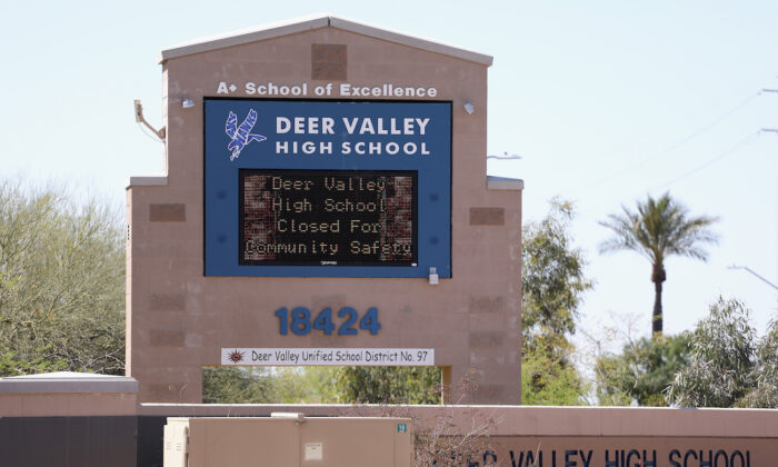 A sign indicating school closure due to the spread of the CCP virus is displayed at Deer Valley High School in Glendale, Ariz., on April 2, 2020. (Christian Petersen/Getty Images)