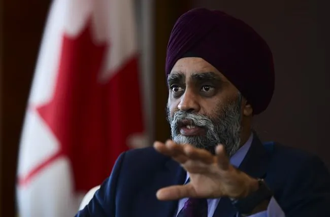 Minister of National Defence Harjit Sajjan takes part in a year-end interview with The Canadian Press at National Defence Headquarters in Ottawa on Dec. 17, 2020. (Sean Kilpatrick/The Canadian Press)