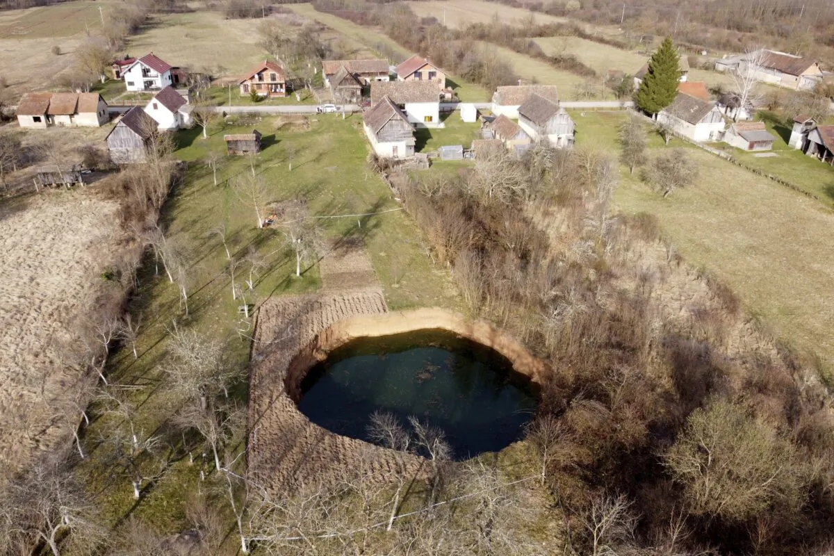 This aerial photo shows a sinkhole in the village of Mececani, central Croatia, on March 4, 2021. (Darko Bandic/AP Photo)