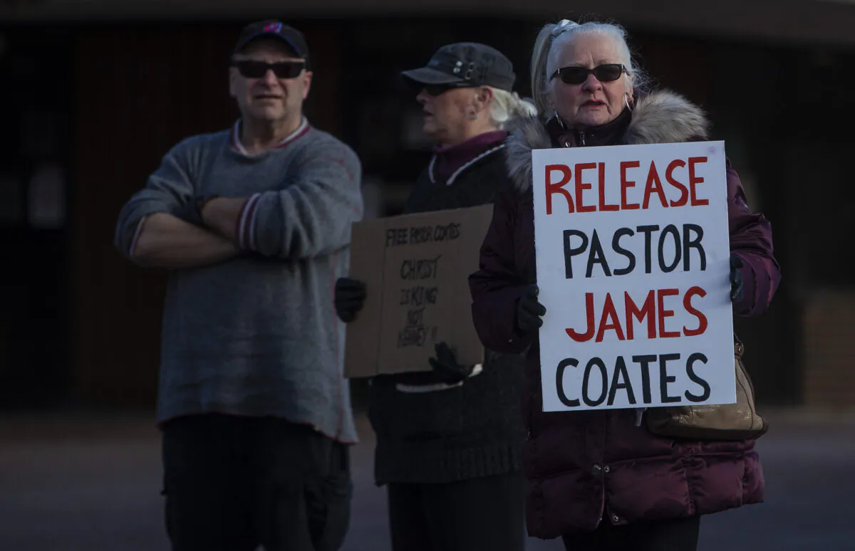 Supporters gather outside court as Pastor James Coates of GraceLife Church is in court after he was arrested the previous week for holding Sunday services in violation of COVID-19 rules, in Stony Plain, Canada, on Feb. 24, 2021. (Jason Franson/The Canadian Press)