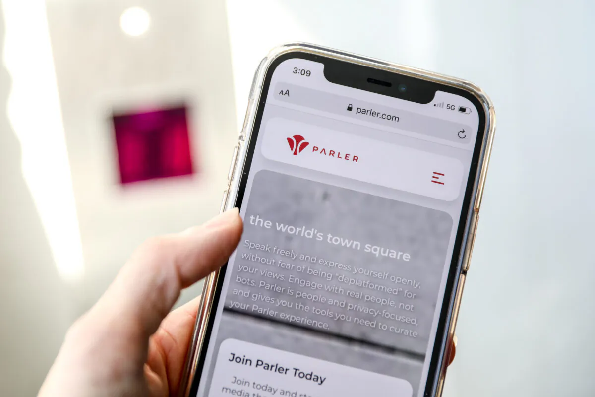 The Parler social media website is displayed on a cell phone in New York City on March 5, 2021. (Samira Bouaou/The Epoch Times)