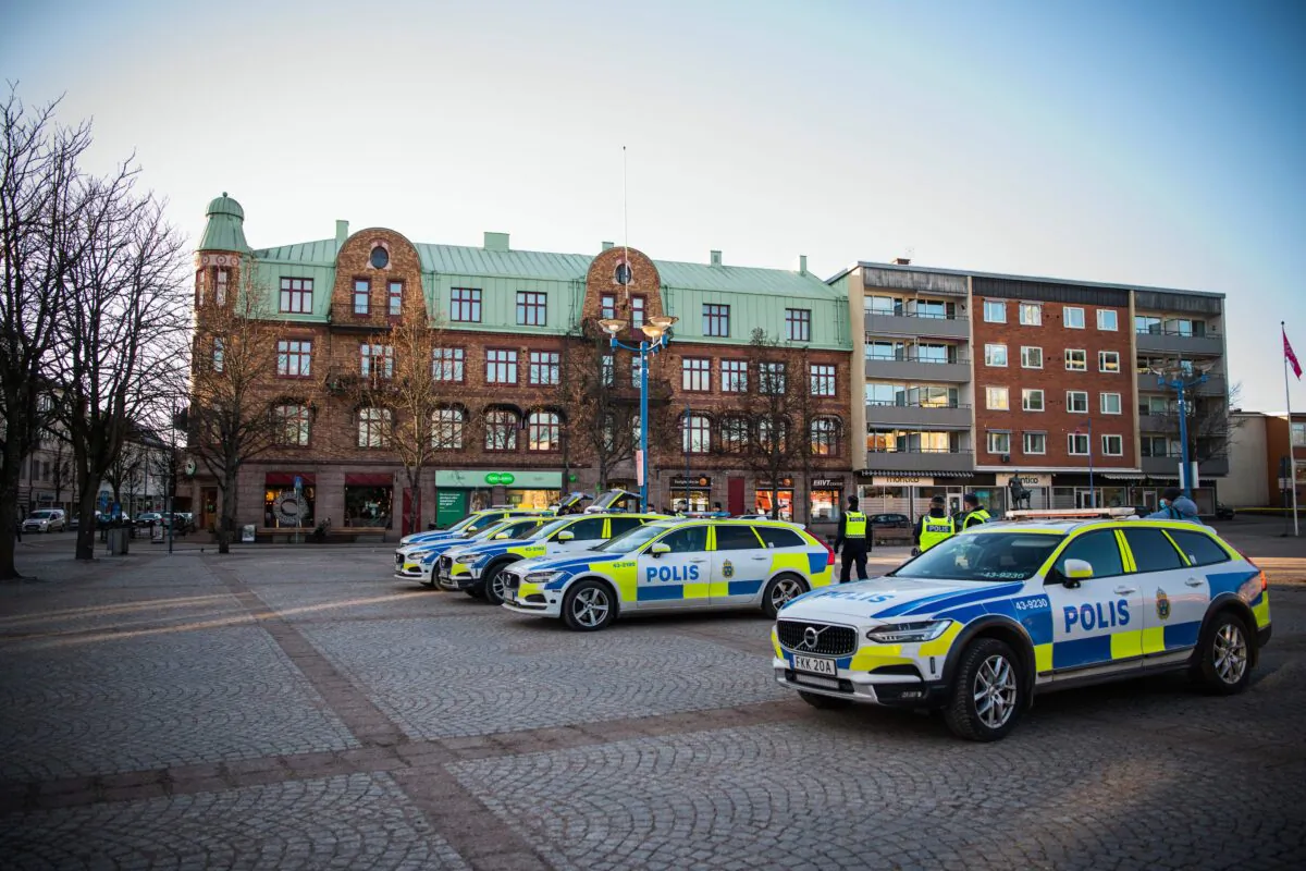Police cars are parked at a main square in the city of Vetlanda, Sweden, on March 4, 2021, one day after a stabbing attack. (Jonathan Nackstrand/AFP via Getty Images)