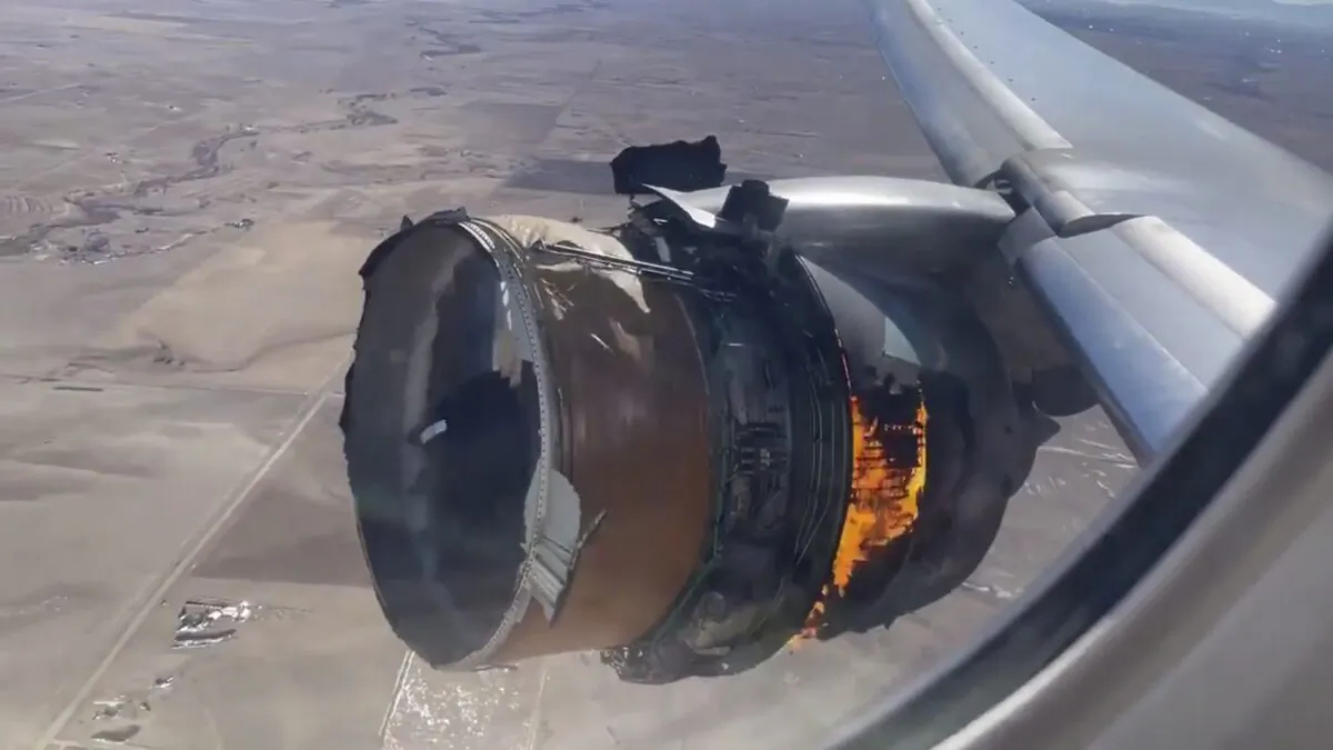 The engine of United Airlines Flight 328 is on fire after experiencing "a right-engine failure" shortly after takeoff from Denver International Airport,  in Denver, Colo., on Feb. 20, 2021. (Chad Schnell via AP)