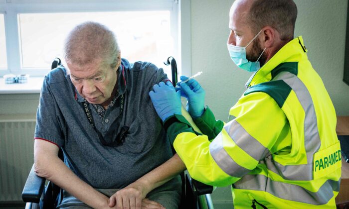 A man receives a COVID-19 vaccine in Aalborg, Denmark, on March 5, 2021. (Bo Amstrup/Ritzau Scanpix/AFP via Getty Images)