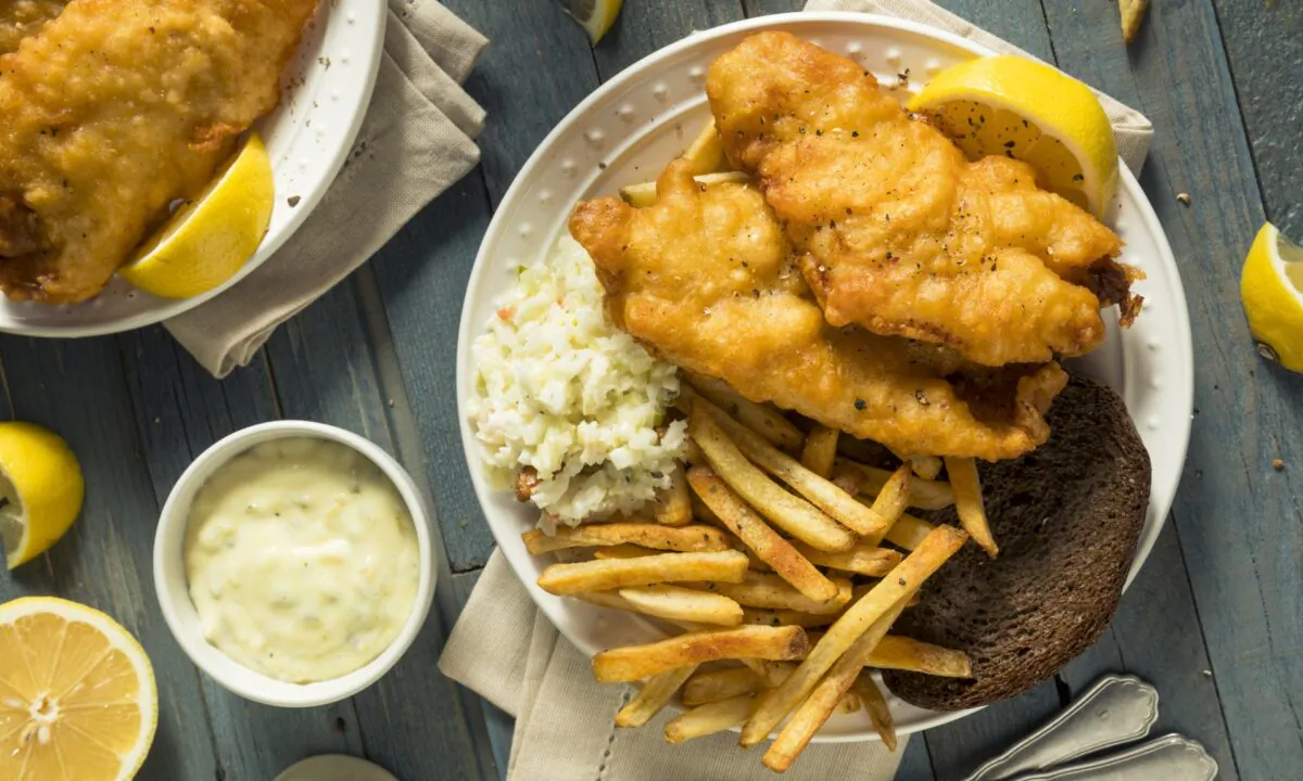 At a typical Friday fish fry, your beer-battered, deep-fried fish comes with a side of coleslaw, maybe a slice of rye bread and pad of butter, and likely French fries or another form of potato. (Brent Hofacker/shutterstock)