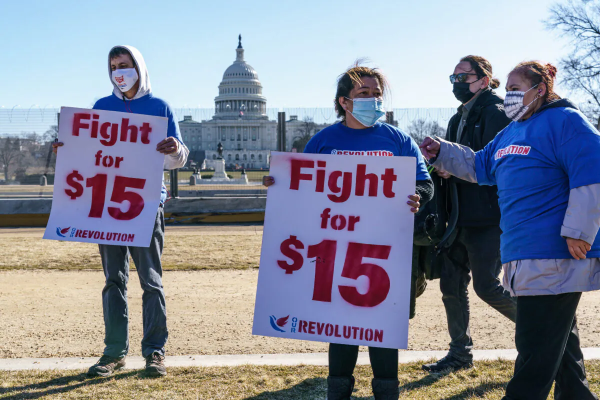 Activists appeal for a $15 minimum wage near the Capitol in Washington on Feb. 25, 2021. (J. Scott Applewhite/AP Photo)