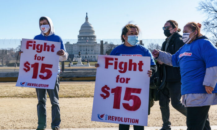 Activists appeal for a $15 minimum wage near the Capitol in Washington on Feb. 25, 2021. (J. Scott Applewhite/AP Photo)