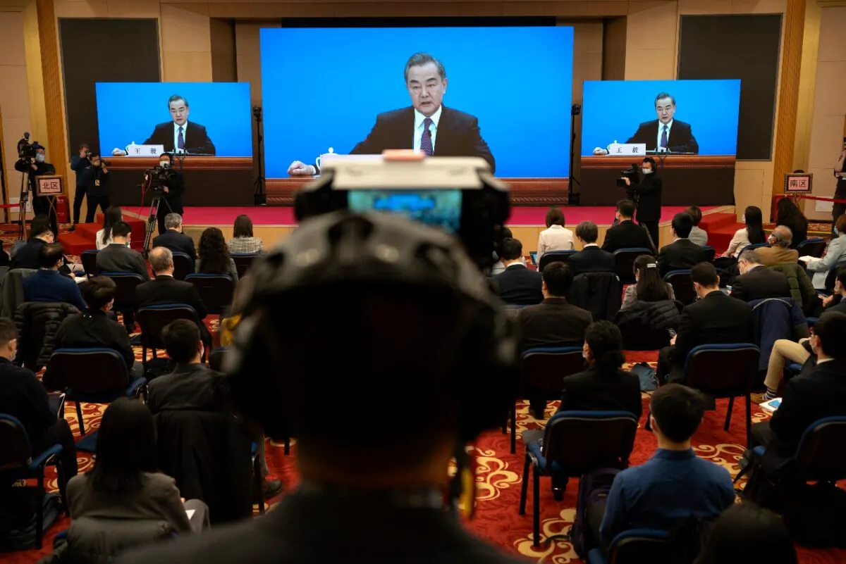 Chinese Foreign Minister Wang Yi speaks during a remote video press conference held on the sidelines of the annual meeting of China's National People's Congress in Beijing, on March 7, 2021. (Mark Schiefelbein/AP Photo)