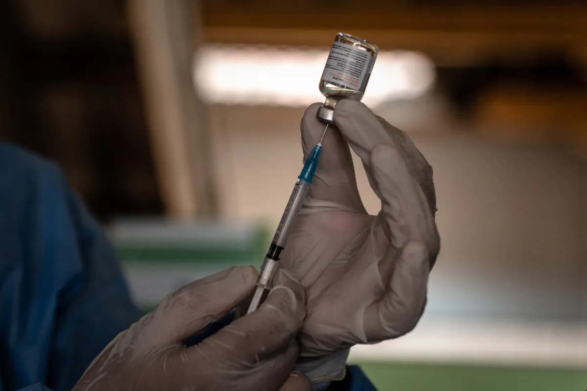 A medical officer prepares a dose of Sinovac COVID-19 vaccine during a mass vaccination program in Yogyakarta, Indonesia, on March 2, 2021. (Ulet Ifansasti/Getty Images)