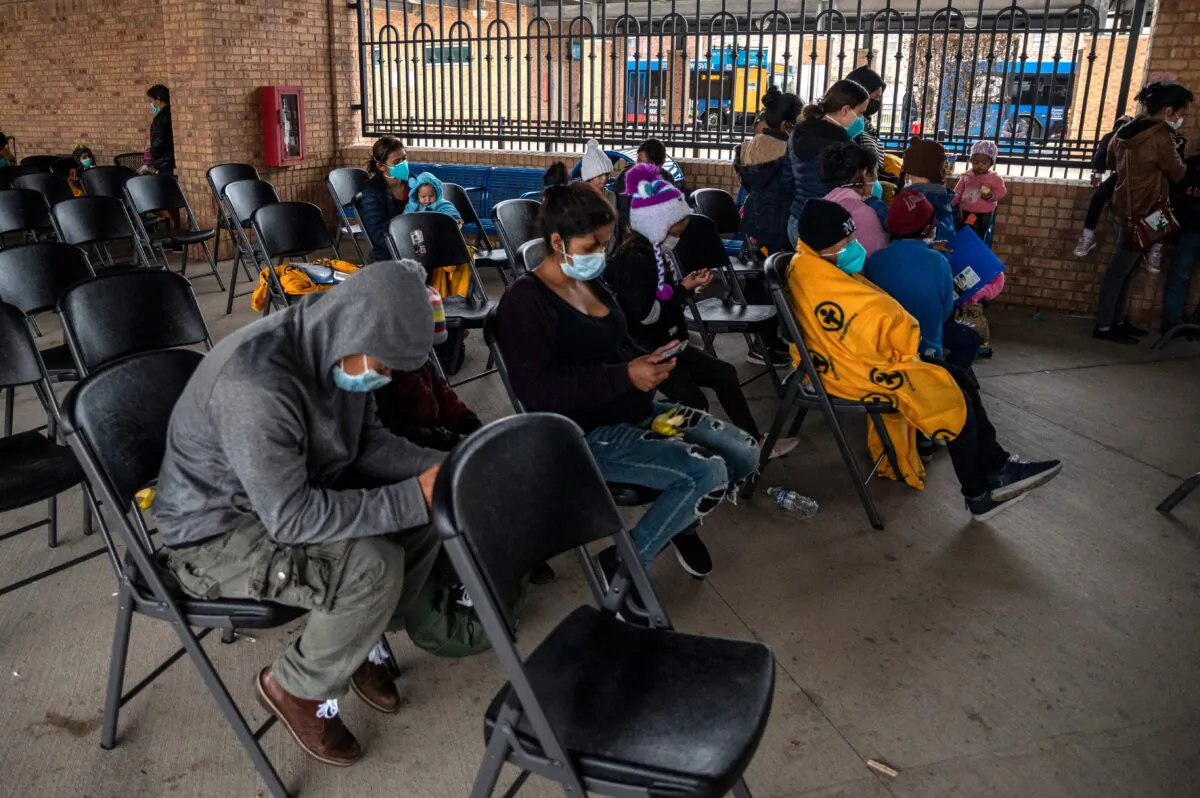 Illegal immigrant families wait for their bus at a bus station in Brownsville, Texas, before traveling to meet relatives or sponsors on March 2, 2021. (Sergio Flores/AFP/Getty Images)