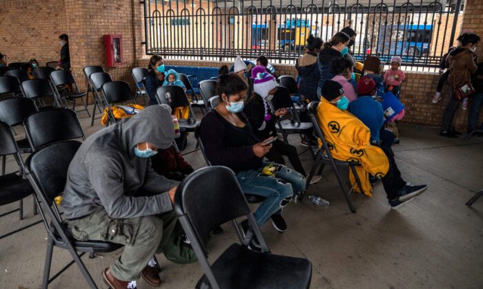 Illegal immigrant families wait for their bus at a bus station in Brownsville, Texas, before traveling to meet relatives or sponsors on March 2, 2021. (Sergio Flores/AFP/Getty Images) 