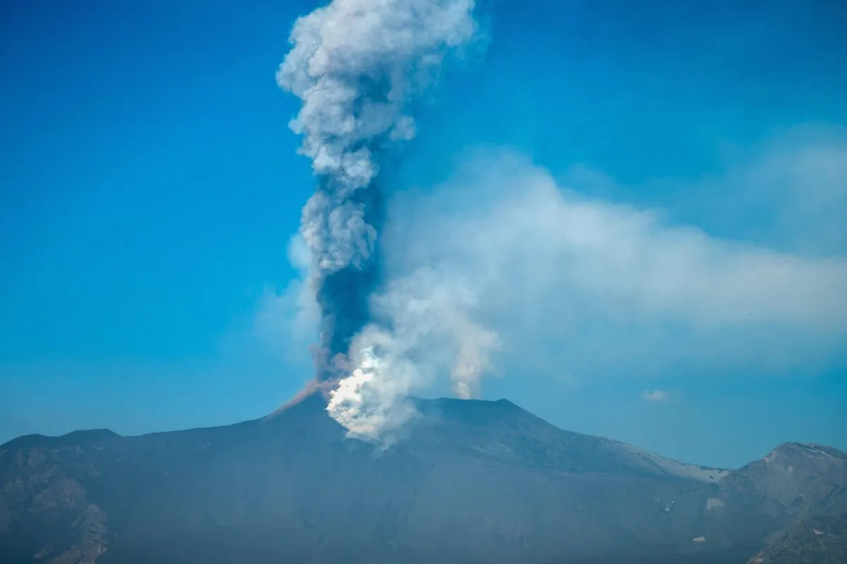 A general view taken from Giarre shows the Mount Etna volcano spewing smoke north of Catania, Sicily, on March 4, 2021. (Giovanni Isolino/AFP via Getty Images)