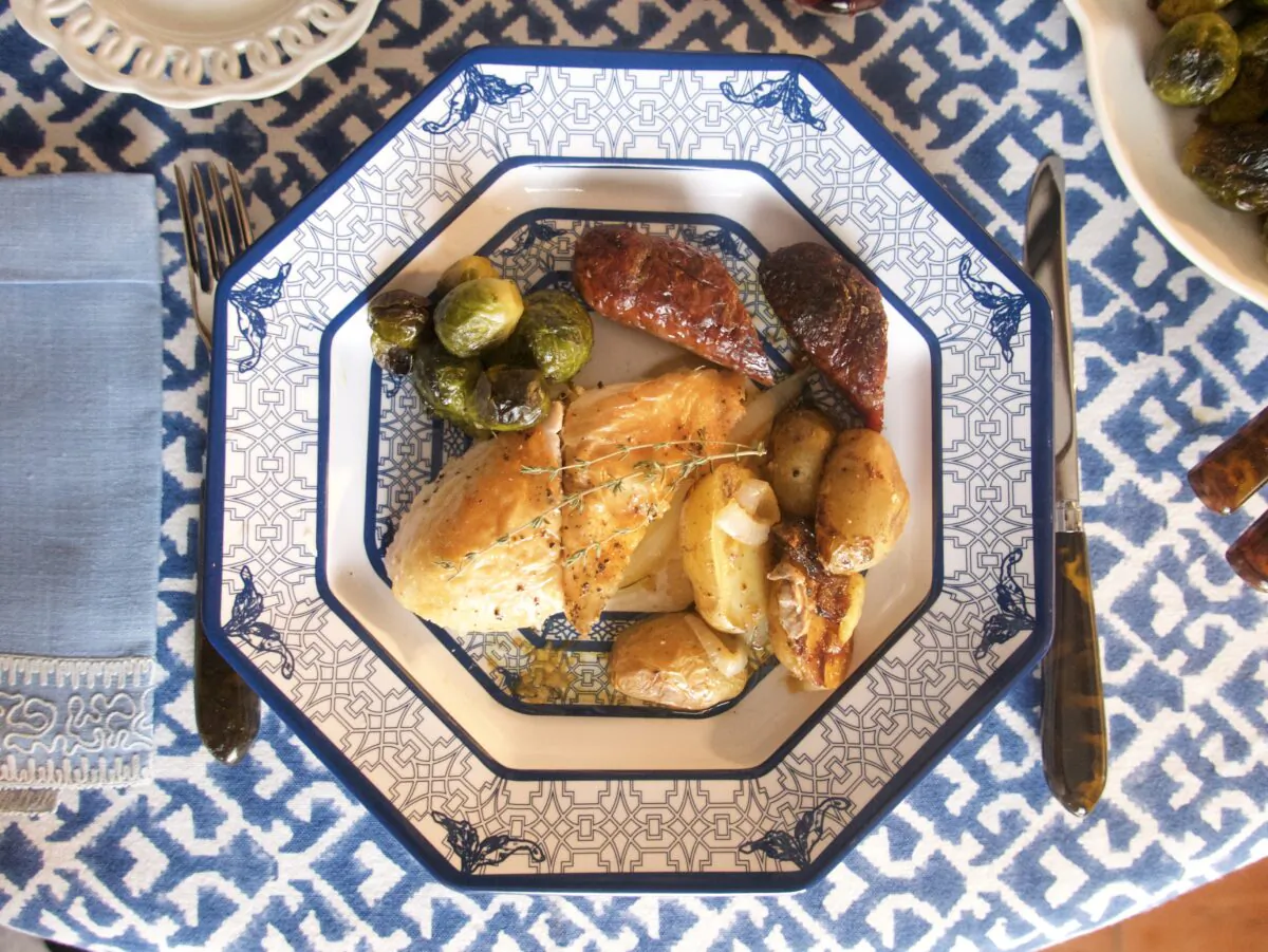 Roasting hot Italian sausages along with the chicken adds both flavor and bulk. (Victoria de la Maza)
