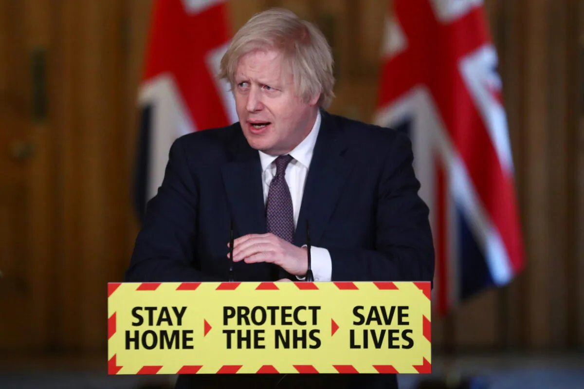 UK Prime Minister Boris Johnson attends a virtual COVID-19 news conference at 10 Downing Street in London on March 8, 2021. (Hannah McKay - WPA Pool/Getty Images)