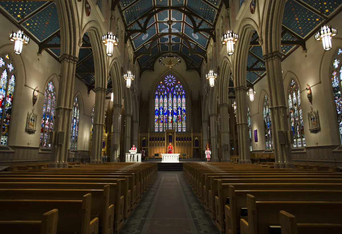 Cardinal Thomas Collins delivers at online Good Friday service in an empty St. MichaelÕs Cathedral in Toronto, Canada, on April 10, 2020.  (Nathan Denette/The Canadian Press)