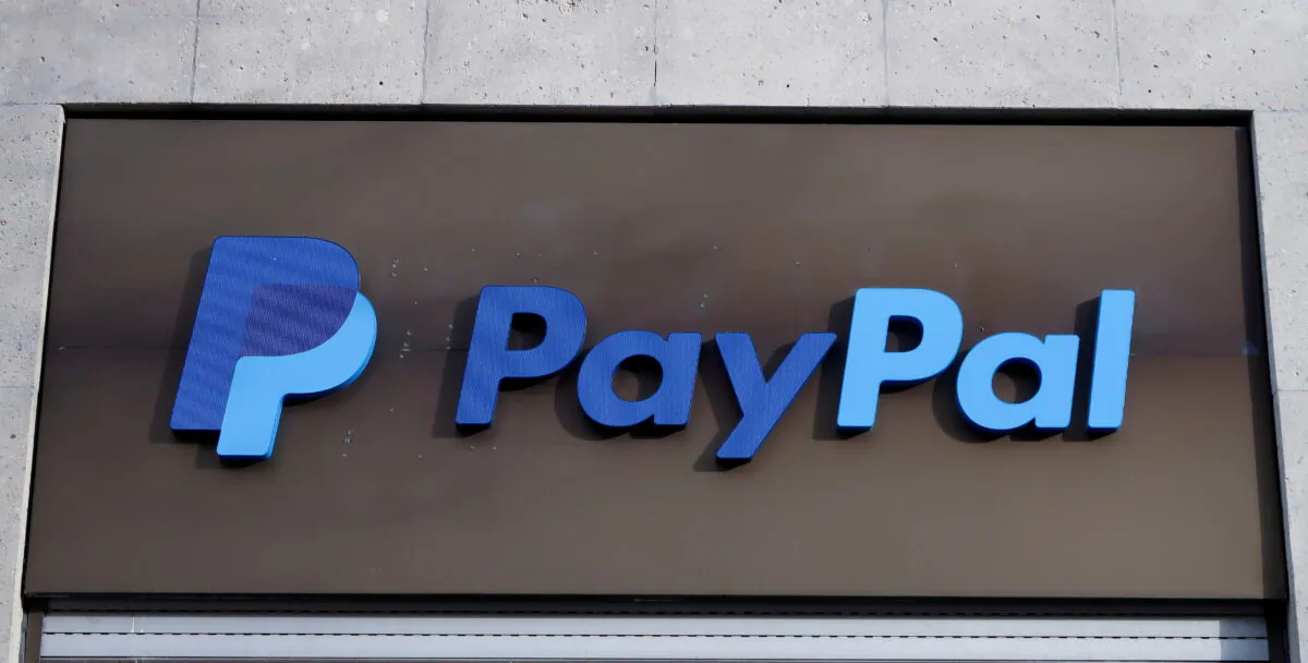 The PayPal logo is seen at an office building in Berlin, Germany, on March 5, 2019. (Fabrizio Bensch/Reuters)