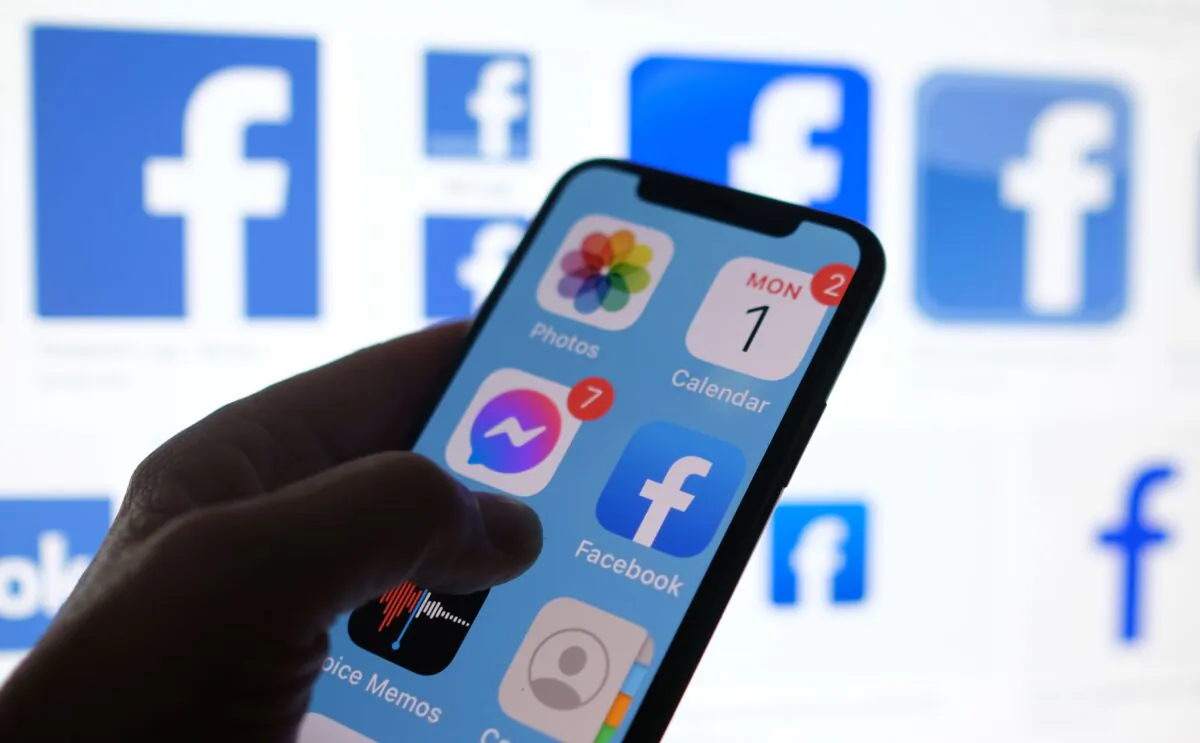 This illustration photo shows a Facebook app logo displayed on a smartphone in Los Angeles, Calif., on March 1, 2021. (Chris Delmas/AFP via Getty Images)