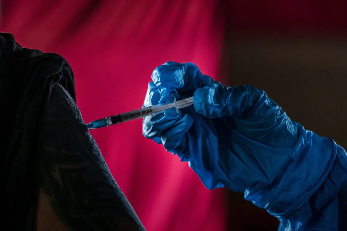 A man receives a dose of Chinese Sinovac-made COVID-19 vaccine during a mass vaccination program in Yogyakarta, Indonesia, on March 2, 2021. (Ulet Ifansasti/Getty Images)
