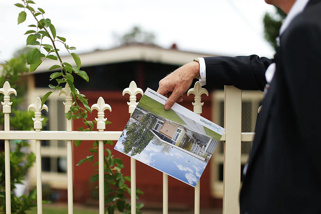 A prospective buyer looks at a property before the home auction for a four-bedroom house on Feb. 14, 2015 in Blacktown, Australia. (Mark Metcalfe/Getty Images)