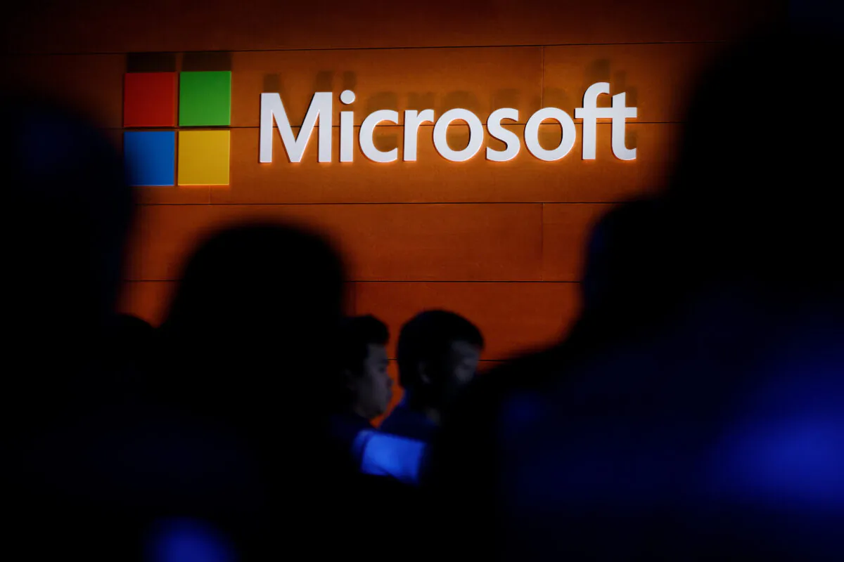 The Microsoft logo is illuminated on a wall during a Microsoft launch event in New York City on May 2, 2017. (Drew Angerer/Getty Images)