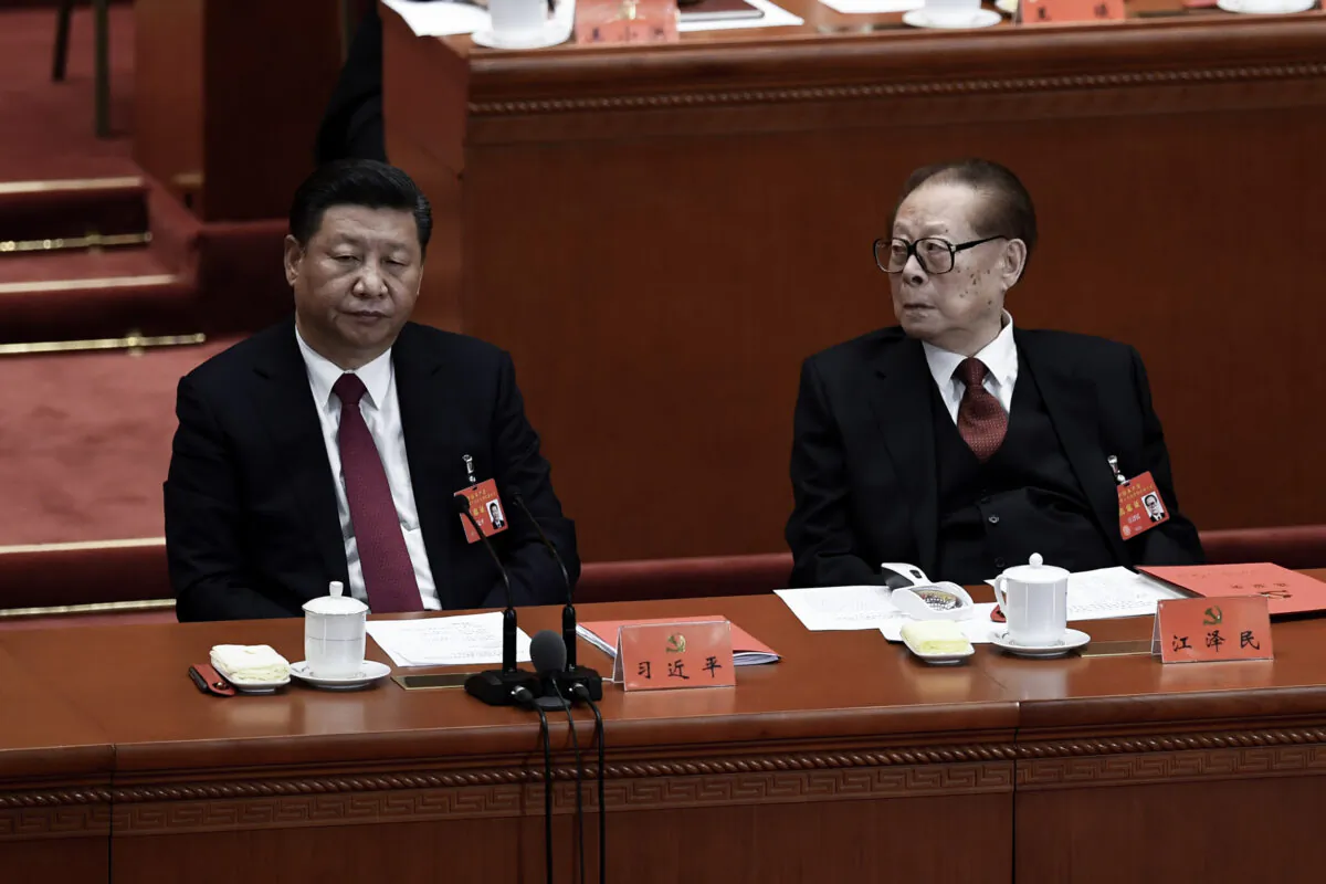 Chinese leader Xi Jinping (L) and his predecessor Jiang Zemin (R) attend the closing of the 19th Communist Party Congress at the Great Hall of the People in Beijing, China on Oct. 24, 2017. (Wang Zhao/AFP via Getty Images)