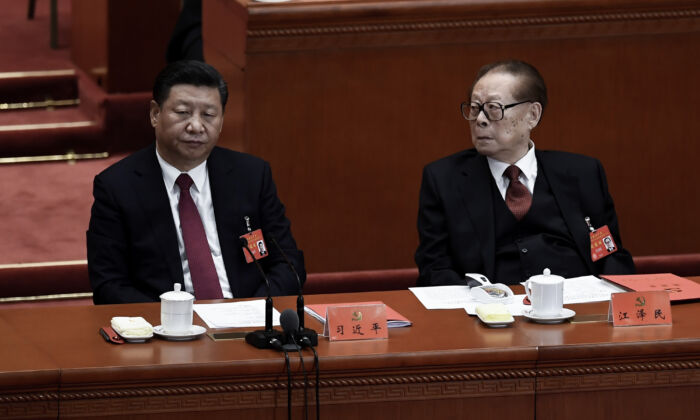 Chinese leader Xi Jinping (L) and his predecessor Jiang Zemin (R) attend the closing of the 19th Communist Party Congress at the Great Hall of the People in Beijing, China, on Oct. 24, 2017. (Wang Zhao/AFP via Getty Images)