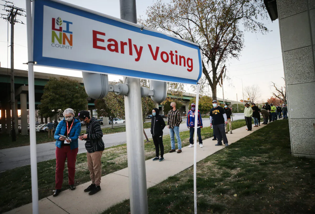 Voters wait in line to cast their ballots on the final day of early voting for the 2020 presidential election in a file photo. (Mario Tama/Getty Images)