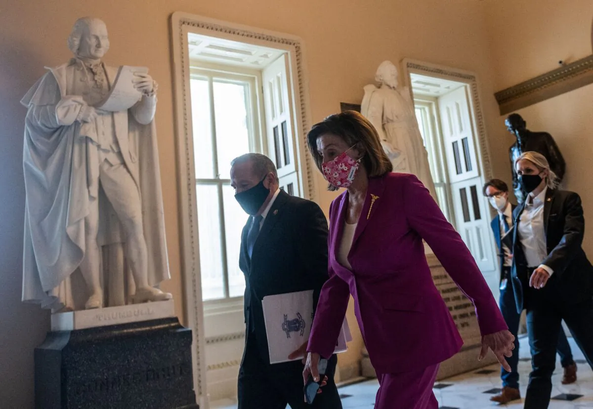 Speaker of the House Nancy Pelosi (D-Calif.) (R) walks to the House side of the US Capitol in Washington, on March 9, 2021. (ANDREW CABALLERO-REYNOLDS/AFP via Getty Images)