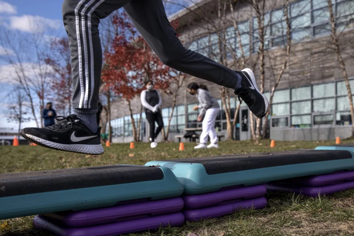 Seventh graders run through an obstacle course while getting exercise outside at Rogers International School in Stamford, Connecticut, on Nov. 24, 2020. (John Moore/Getty Images)