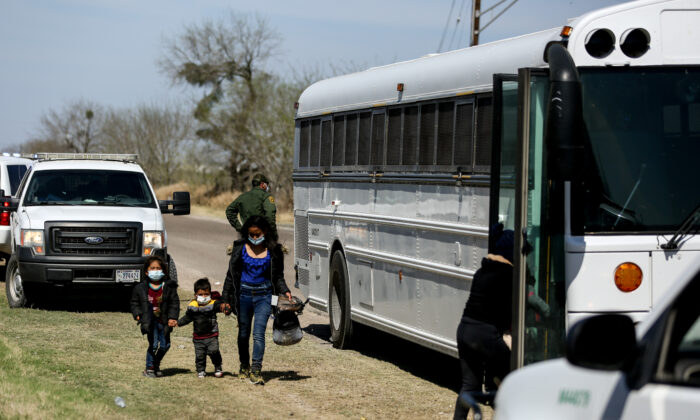 Border Patrol agents apprehend a busload of illegal immigrants in Penitas, Texas, on March 10. 2021. (Charlotte Cuthbertson/The Epoch Times)