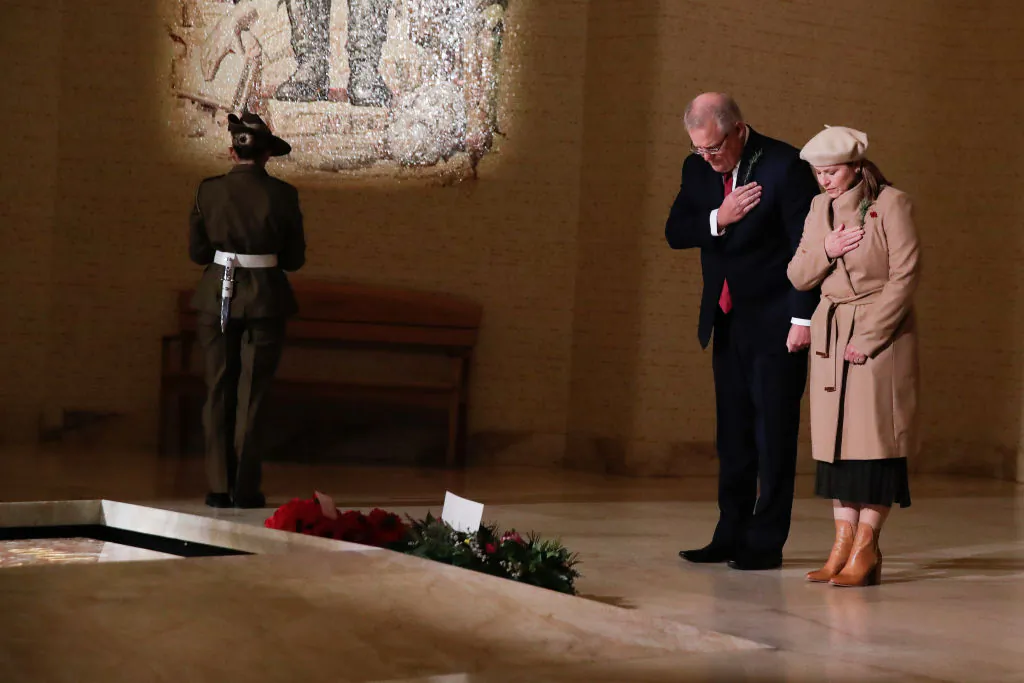 Prime Minister Scott Morrison and Jenny Morrison lay a wreath at the Tomb of the Unknown Australian Soldier during the Anzac Day commemorative service at the Australian War Memorial on April 25, 2020 in Canberra, Australia. (Alex Ellinghausen-Pool via Getty Images)